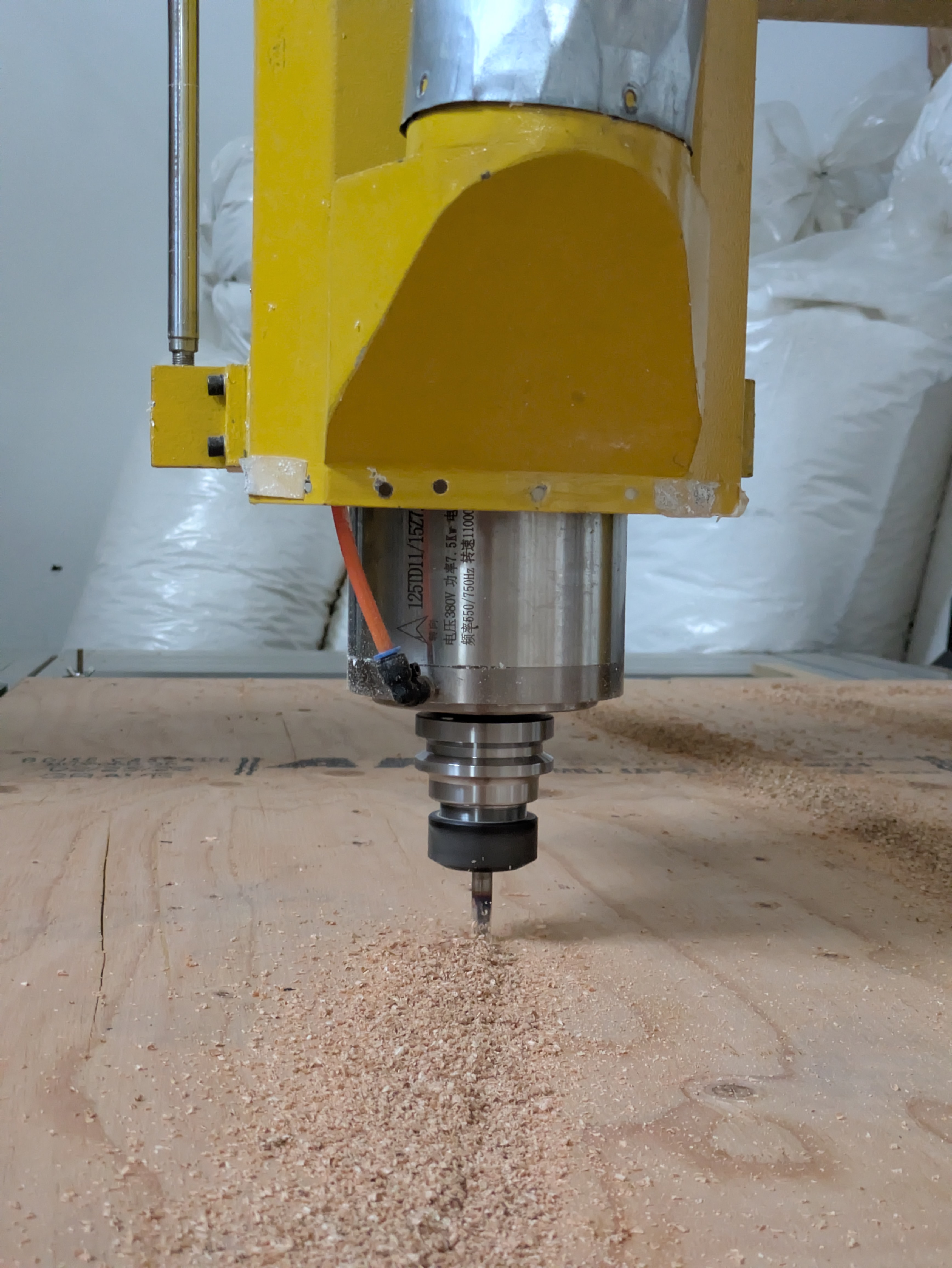 CNC machine cutting a plywood component