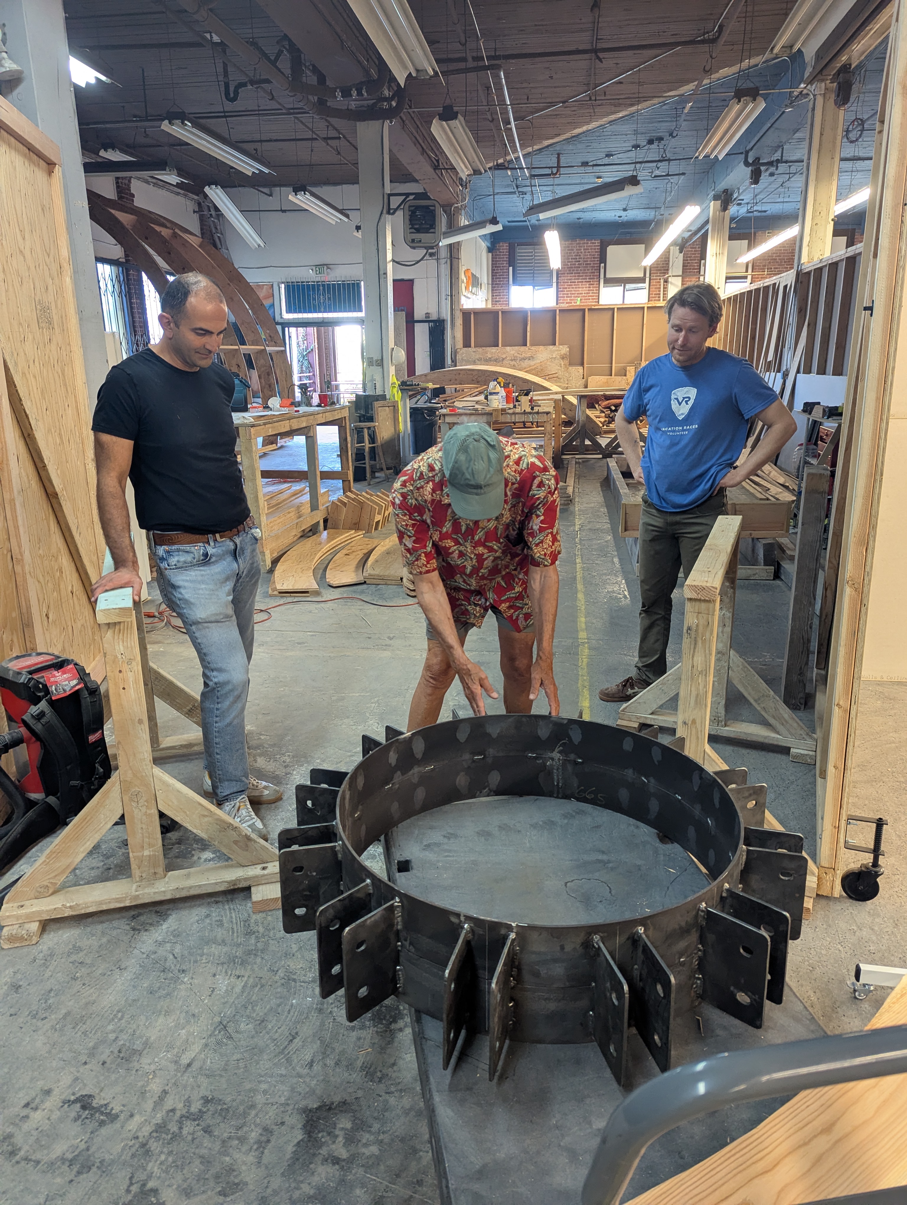 Team members collaborating around the build